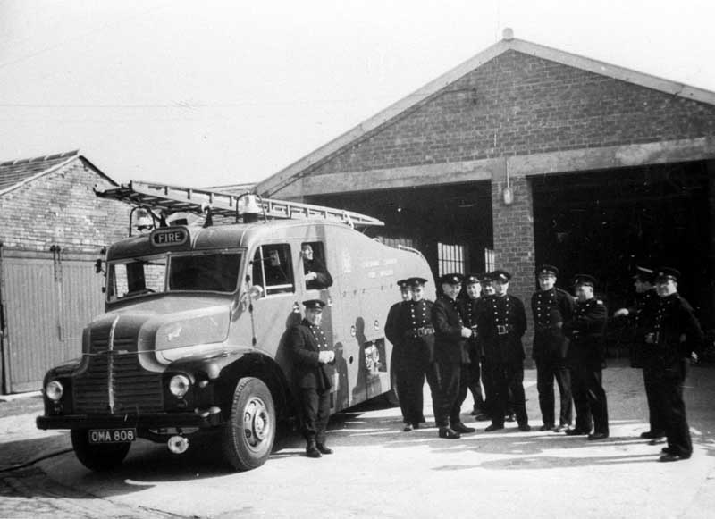 Cheshire County fire brigade with tender outside fire station